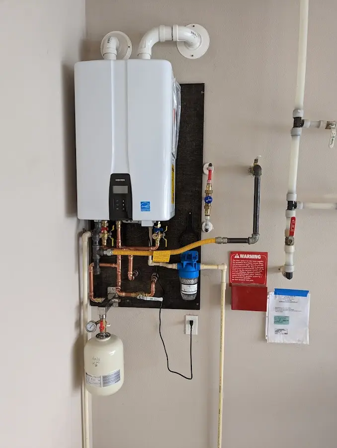 Professional plumber installing copper piping in a Port Angeles home